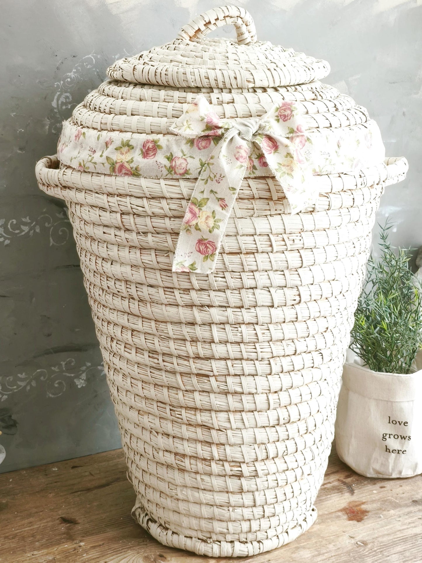 Vintage White Woven Seagrass Basket with Lid and Floral Bow: Boho Laundry Hamper